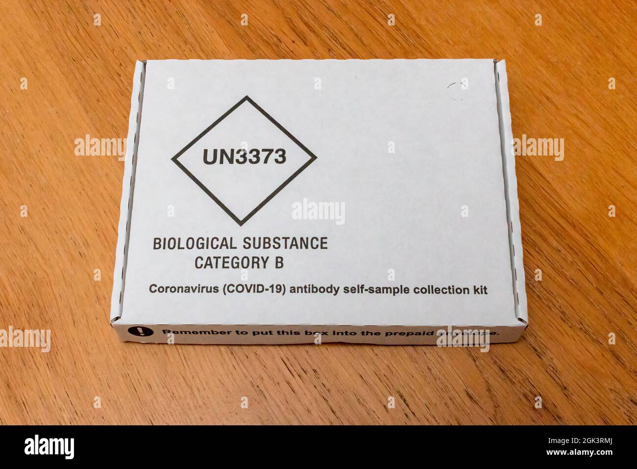 An external view of a government provided Covd-19 antibody self sample  collection kit. The sample is then posted to a lab to be processed. Stock Photo