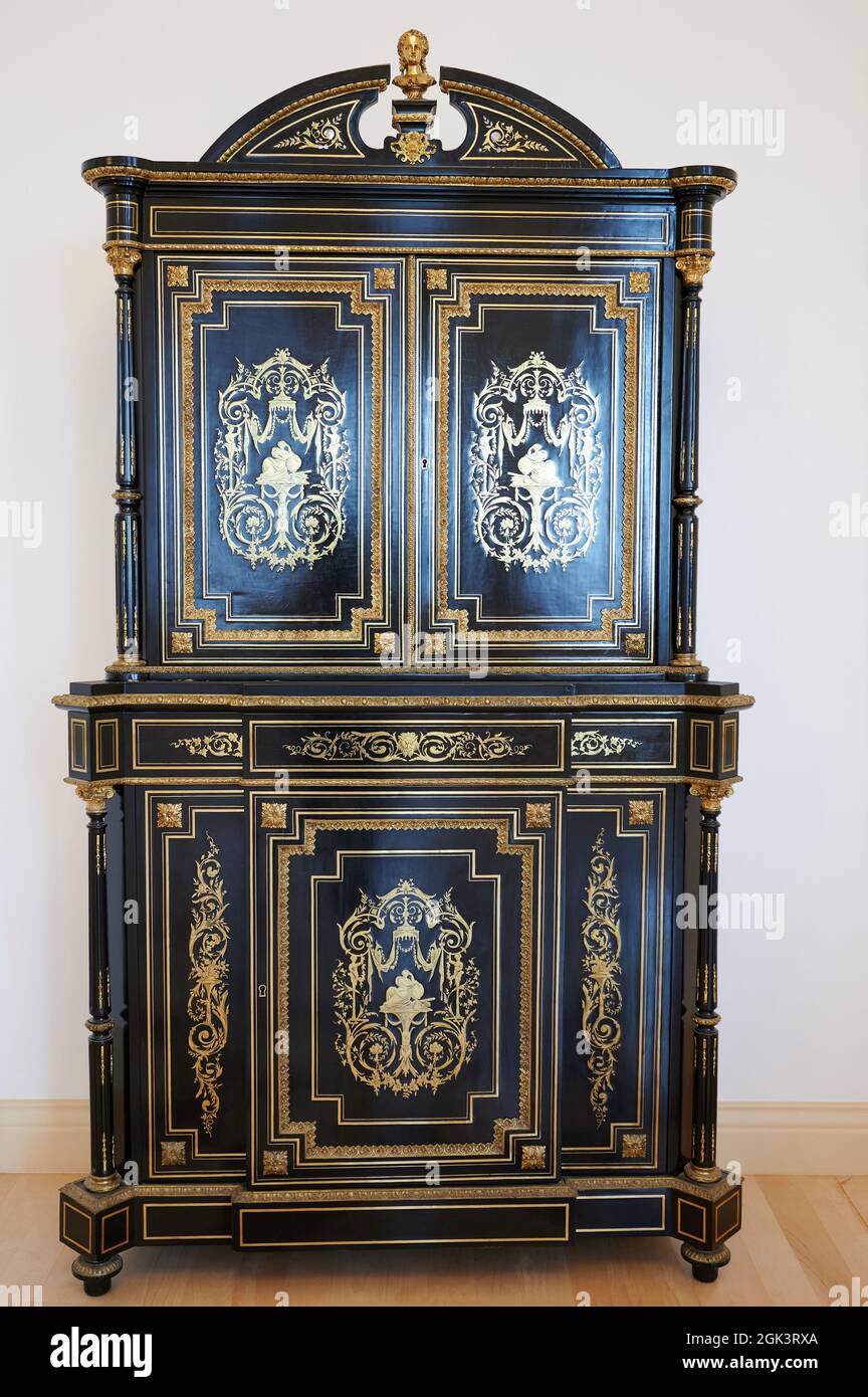 Old decorated wardrobe with golden ornament Stock Photo