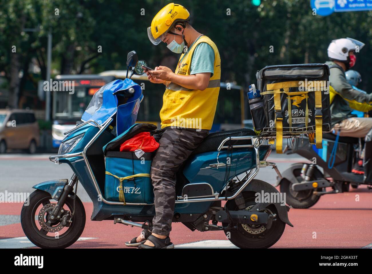 Two delivery drivers from Meituan in Beijing, China. 13-Sep-2021 Stock Photo