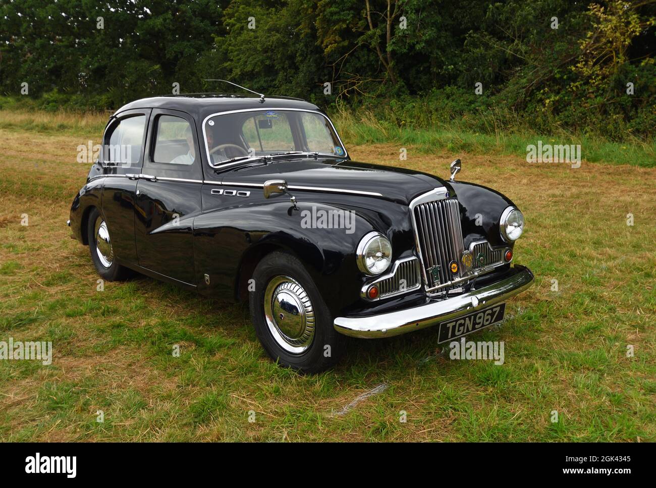 Classic Black Sunbeam 1956 Talbot 90 MK3 Motor Car parked isolated on grass. Stock Photo