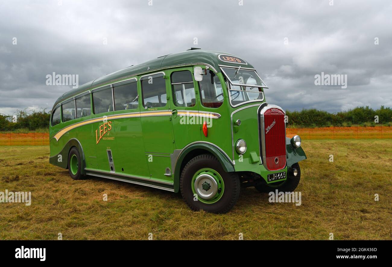 Vintage Duple bodied Dennis Lancet Coach parked isolated on grass. Stock Photo
