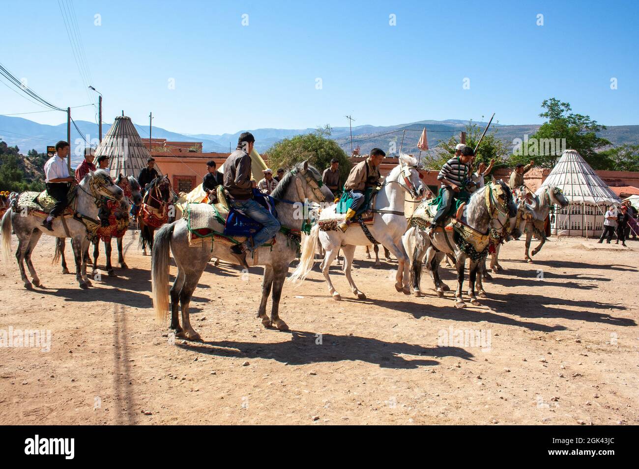 Horse riders in Festival Fantasia in rural Morocco - a traditional Berber spectacle of horsemanship Stock Photo