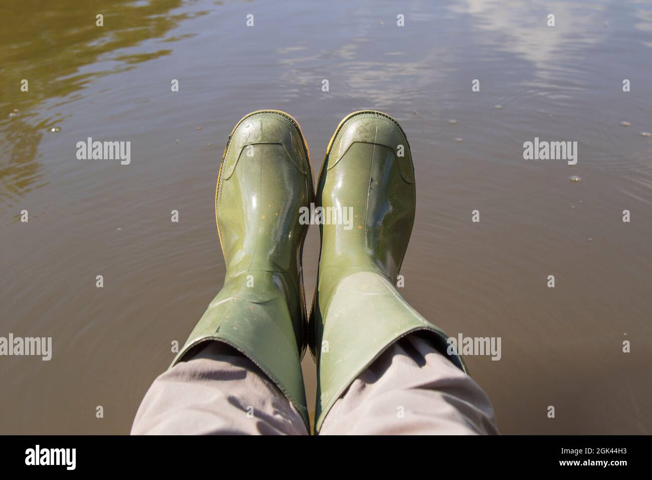 Top view of a pair of green wellington boots worn by a person over ...