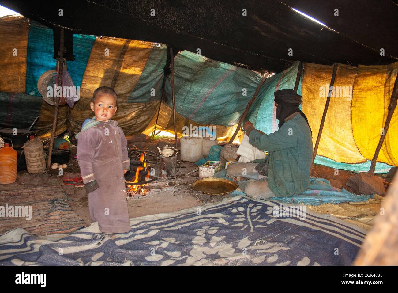 Locals and tent in the Moroccan Sahara Stock Photo