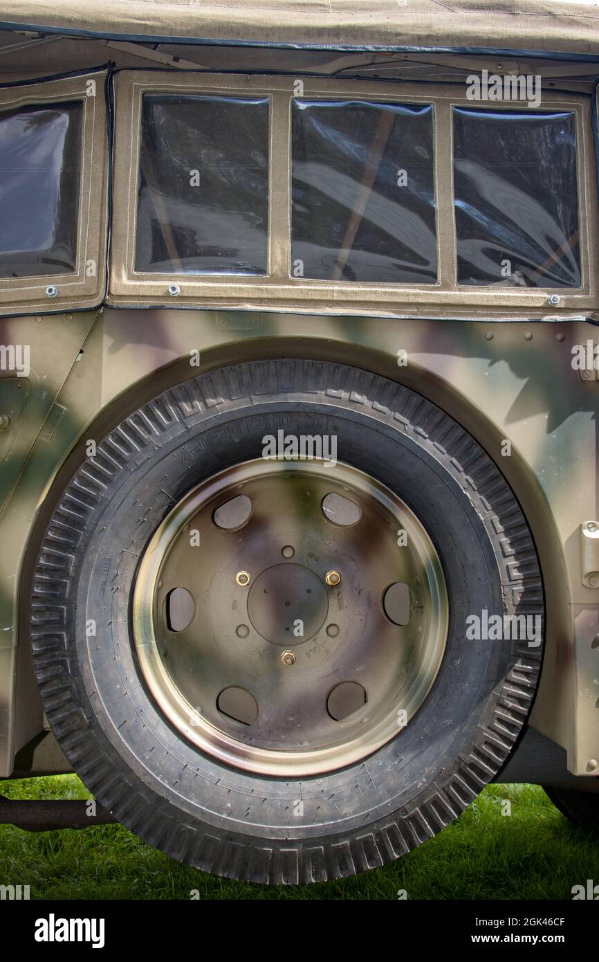 A spare wheel attached to the body of an retro army vehicle Stock Photo
