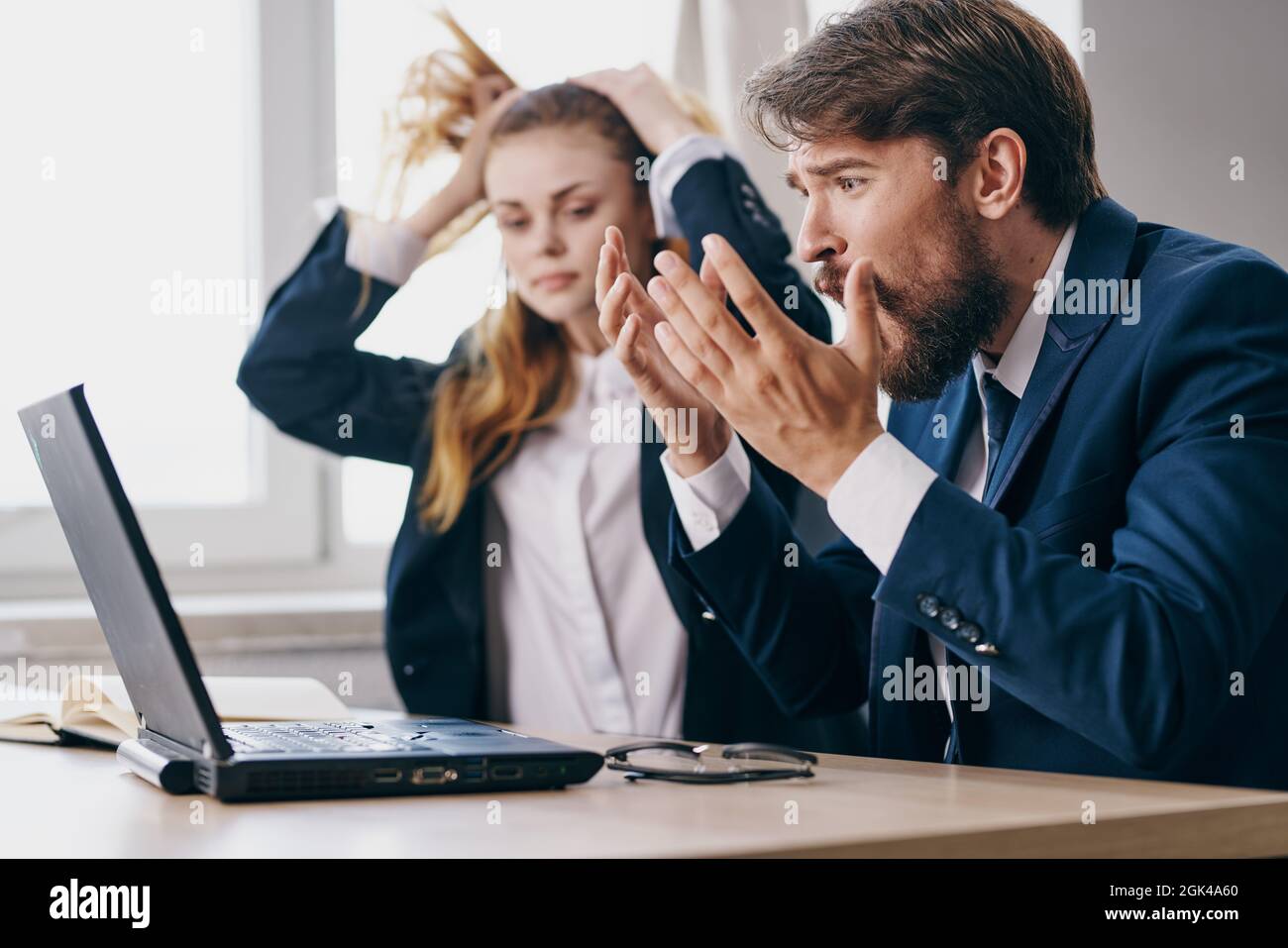 managers in the office in front of a laptop career work officials Stock ...