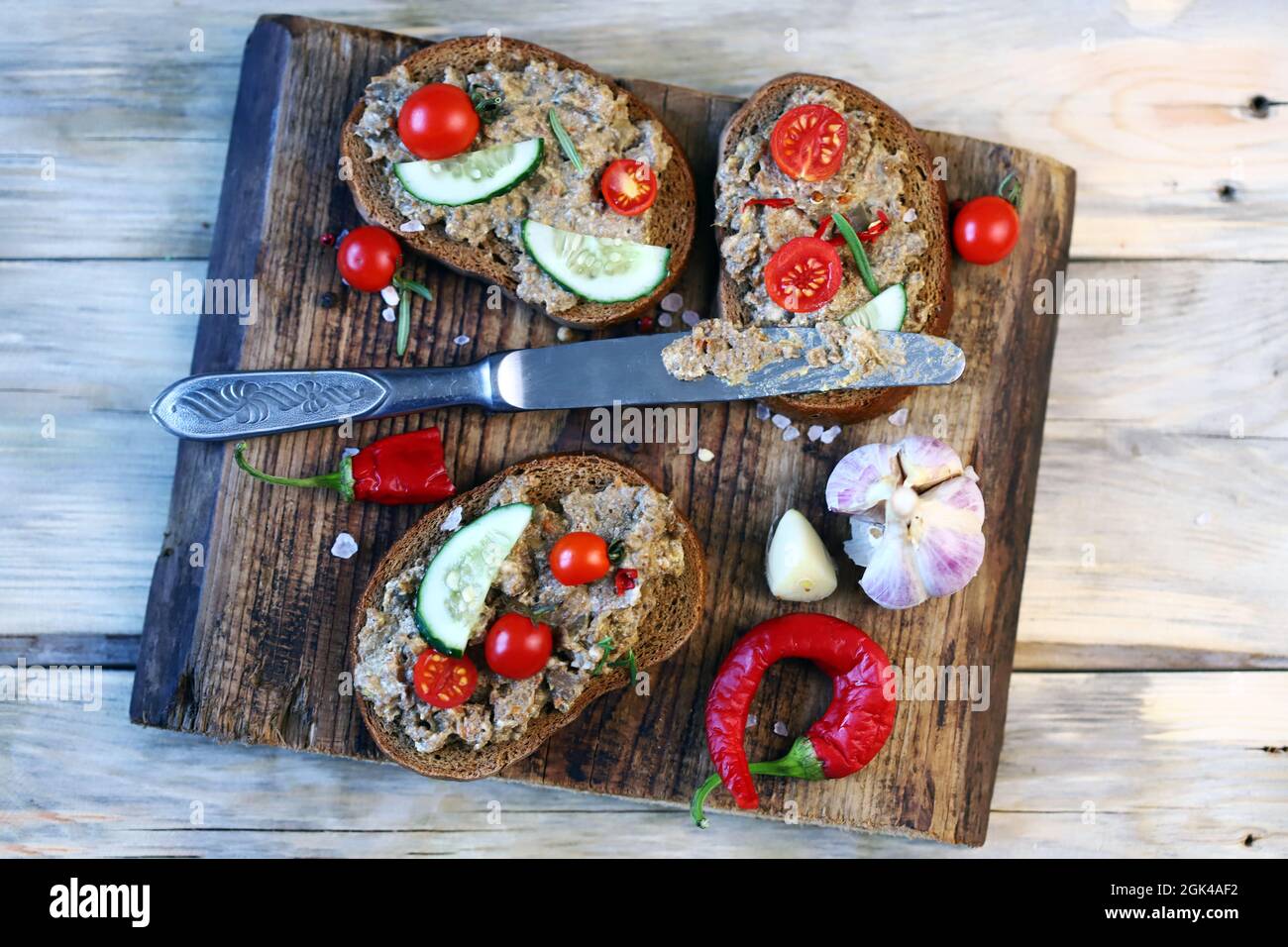 Sandwiches with pate on a wooden board. Healthy snack. The keto diet. Stock Photo