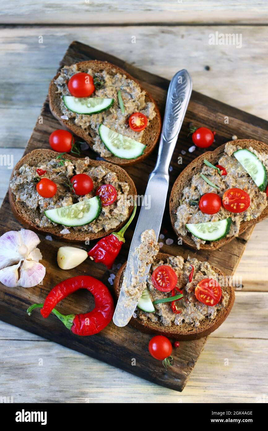 Sandwiches with pate on a wooden board. Healthy snack. The keto diet. Stock Photo