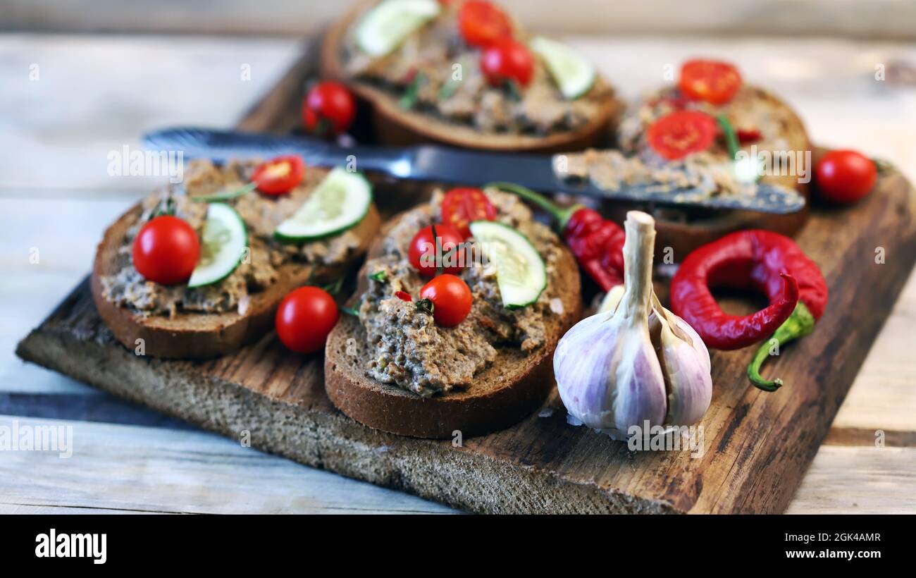 Sandwiches with pate on a wooden board. Healthy snack. The keto diet. Stock Photo