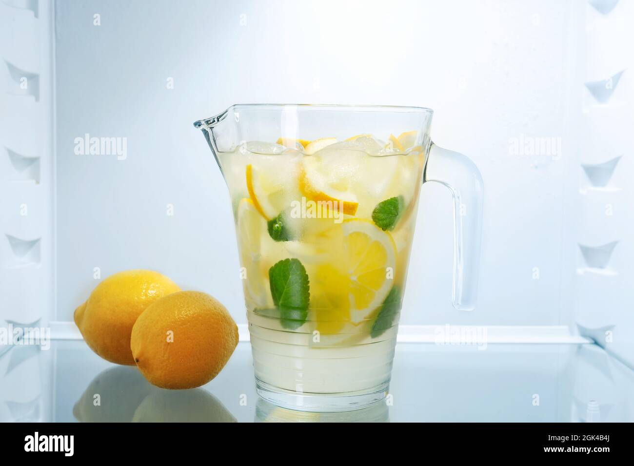 Jug of fresh lemonade in fridge Stock Photo Alamy