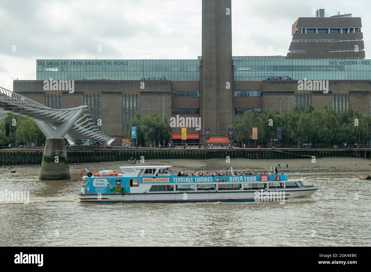 London, September, 2021: The Terrible Thames river boat tour cruising past the Tate Modern. A theatrical river cruise tour and popular tourist activit Stock Photo