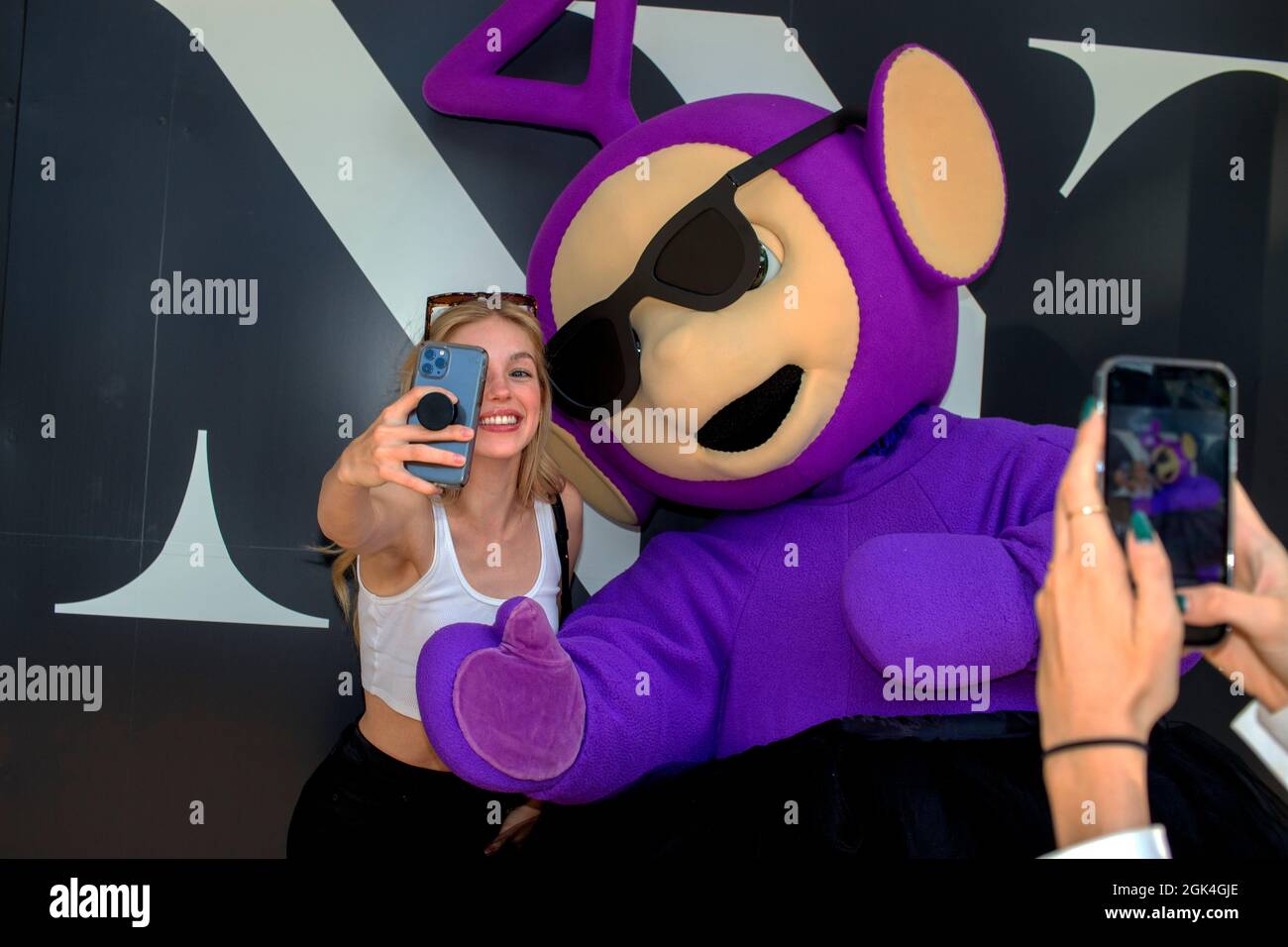 New York, NY, USA. 10th Sep, 2021. Tinky Winky the Teletubby outside Spring Studios in New York, Sept. 10, 2021. The Council of Fashion Designers of America live shows will run through Sept. 12, after two seasons of digital presentations. There are plans to hold 91 runway shows from American and international designers. Everybody entering the venue is required to show proof of COVID-19 vaccination. (Credit Image: © John Marshall Mantel/ZUMA Press Wire) Stock Photo