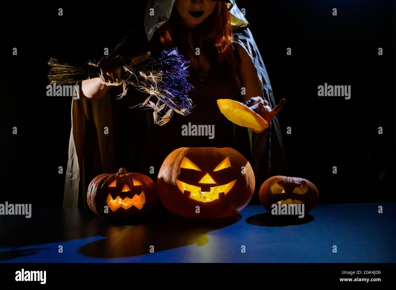 A Witch Casts A Spell In The Dark On Halloween Eve Stock Photo Alamy
