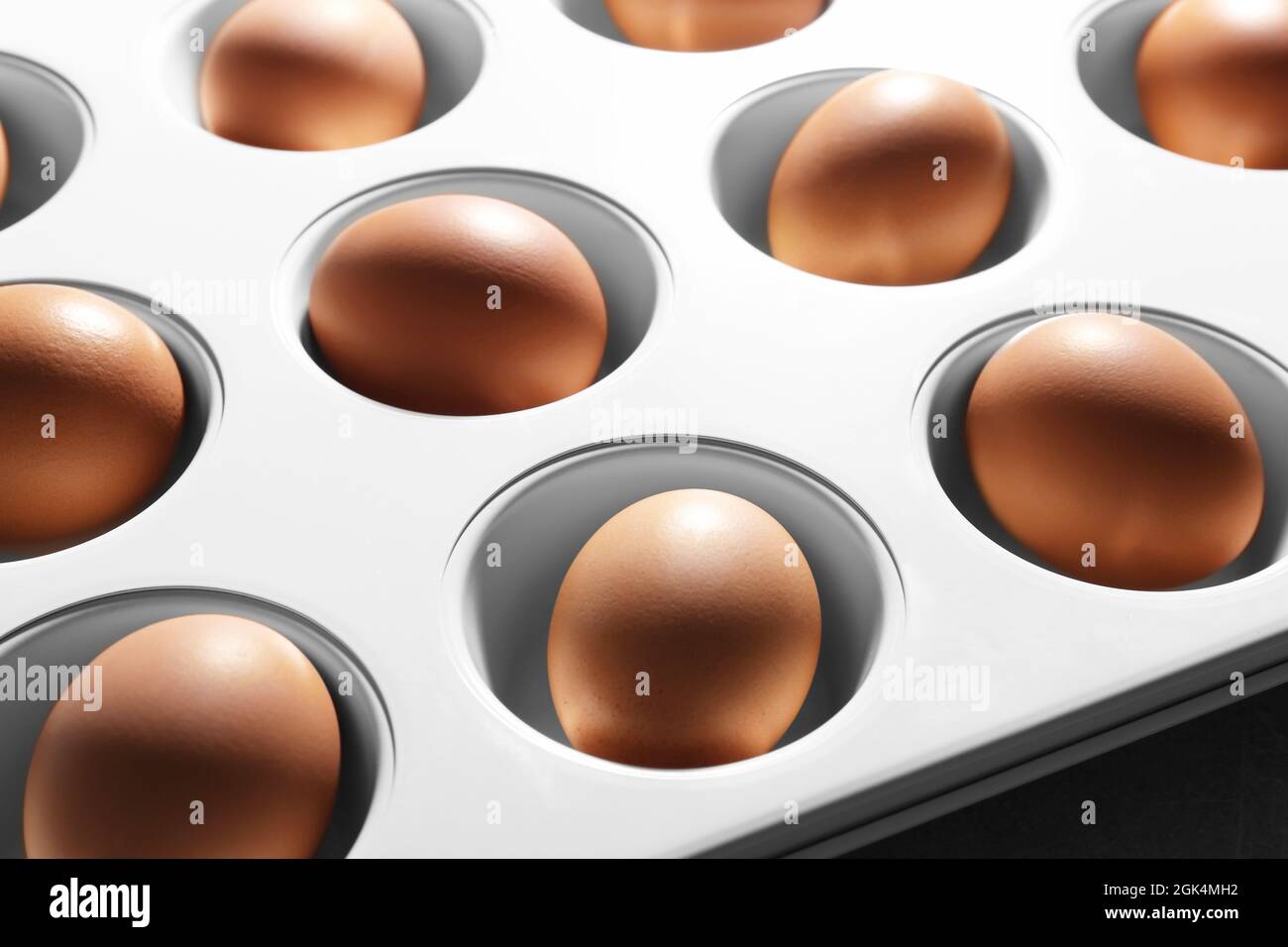Muffin tin with hard boiled eggs, closeup Stock Photo Alamy