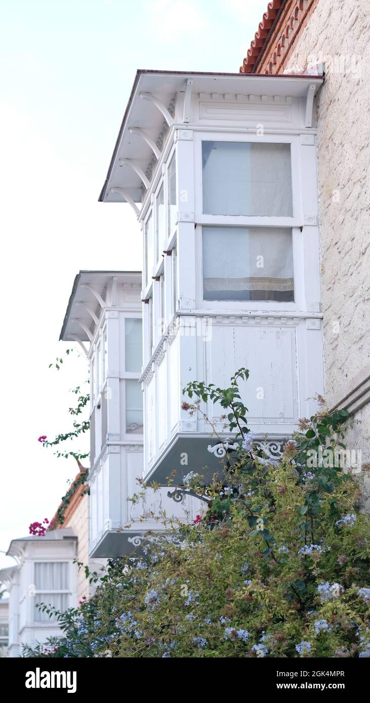 village house with white balcony Stock Photo