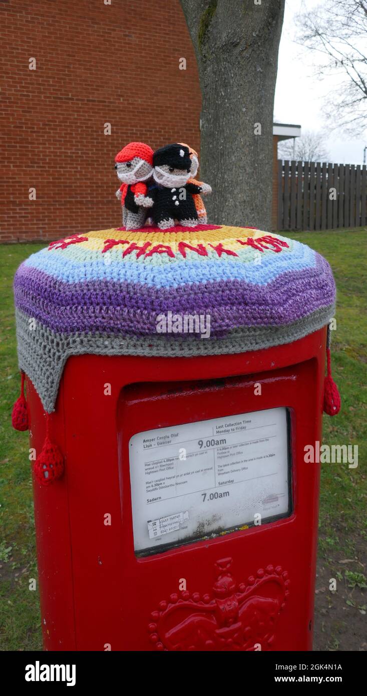 Red United Kingdom Post Box with knitted Cover Stock Photo
