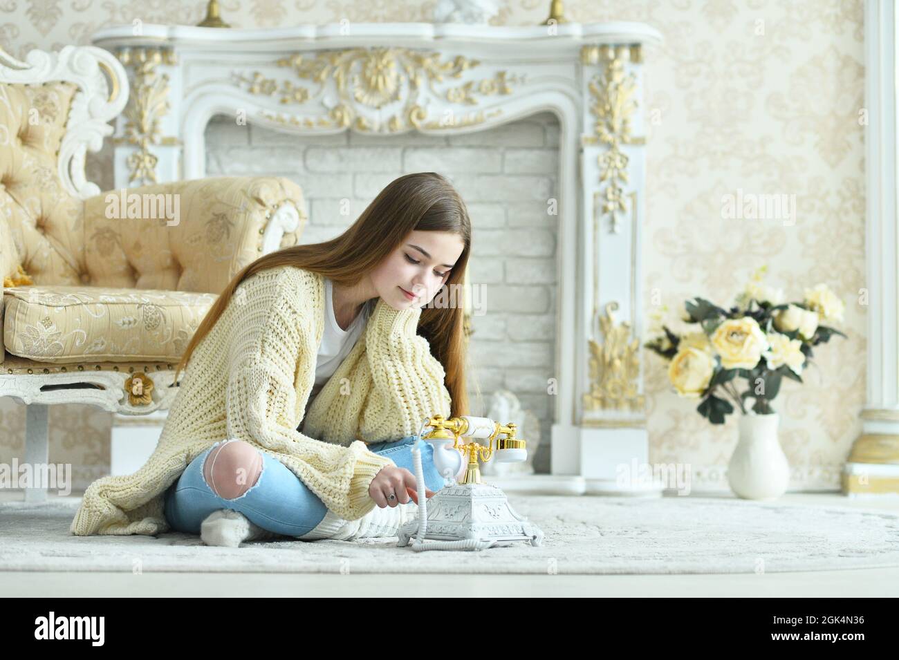 Portrait of beautiful teen girl sitting on floor Stock Photo - Alamy