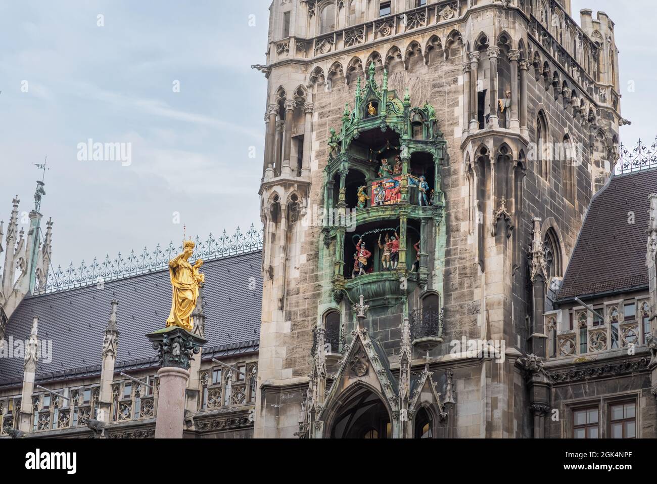 Glockenspiel clock of New Town Hall (Neues Rathaus) Tower and Mariensäule Column - Munich, Bavaria, Germany Stock Photo