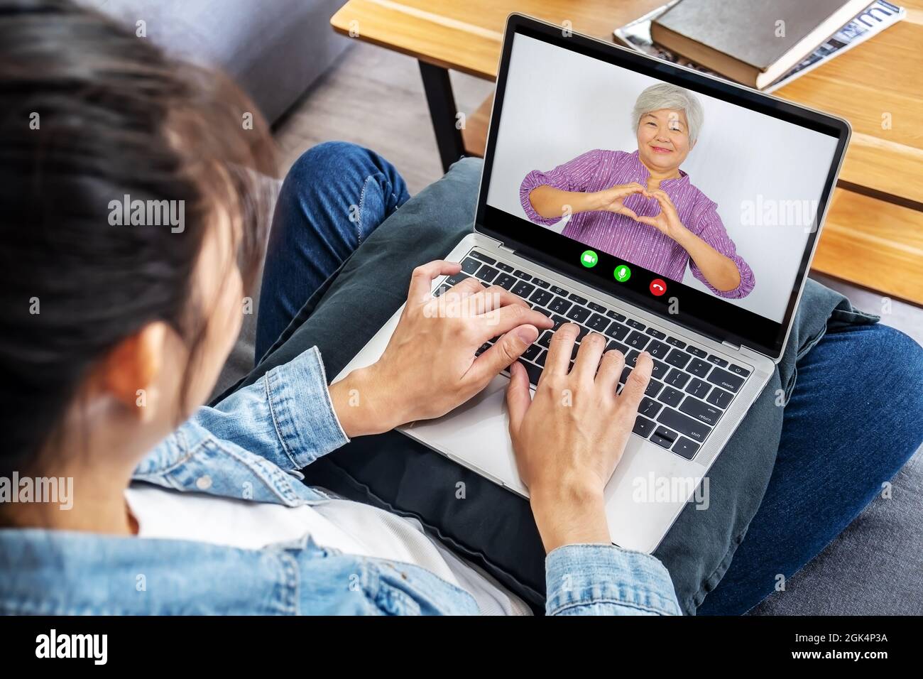 Happy senior woman or mother making video call with grown up young daughter woman Stock Photo