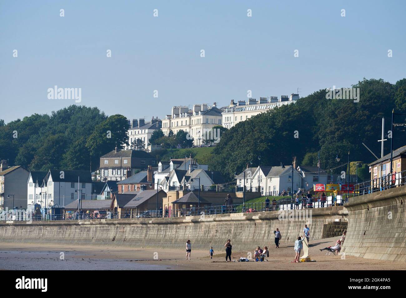 The victorian houses facing Filey Beach, North Yorkshire east coast, busy with holiday makers, Northern England, UK Stock Photo