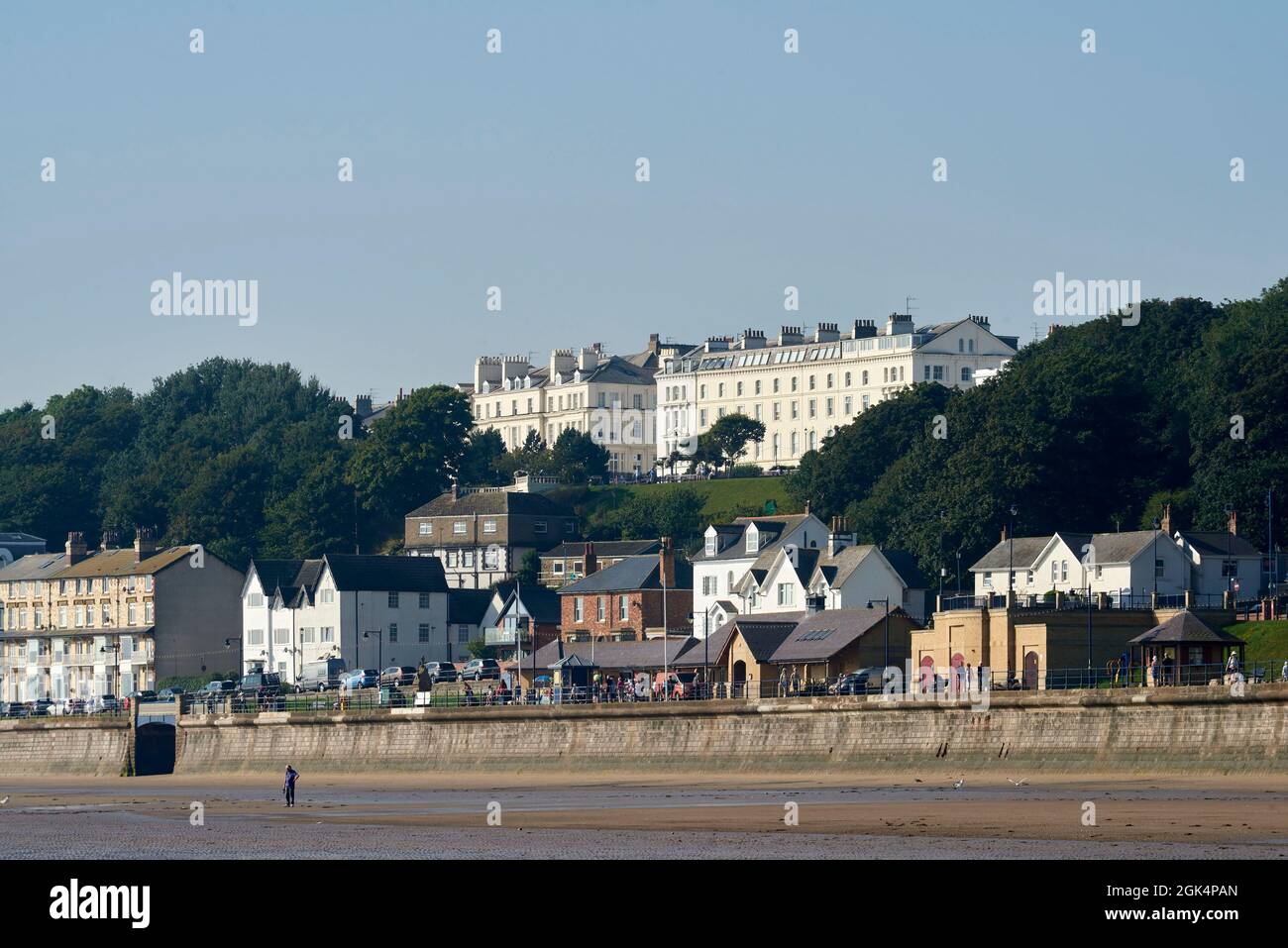 The victorian houses facing Filey Beach, North Yorkshire east coast, busy with holiday makers, Northern England, UK Stock Photo