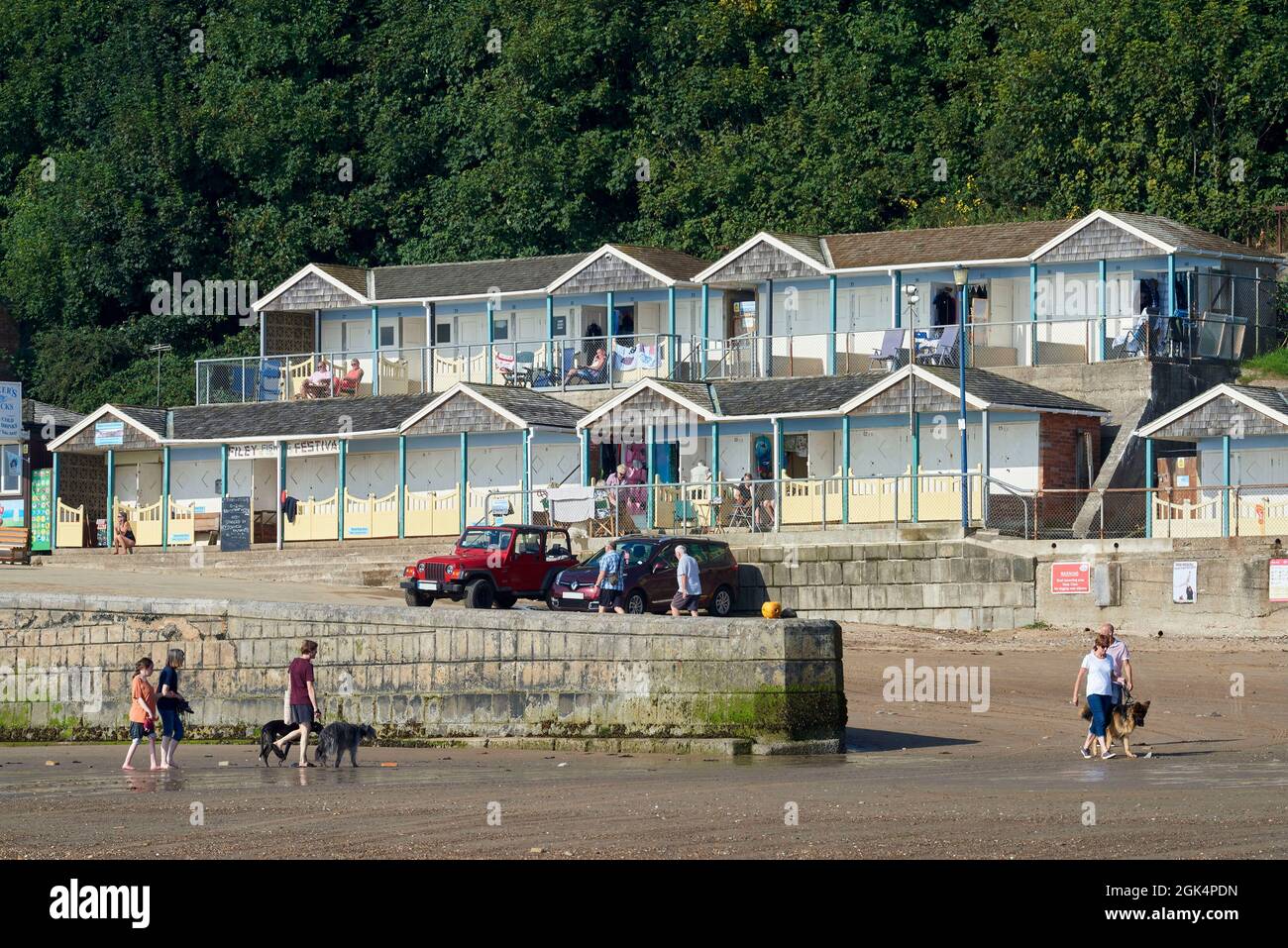 Beach Huts at Filey Beach, North Yorkshire east coast, busy with holiday makers, Northern England, UK Stock Photo