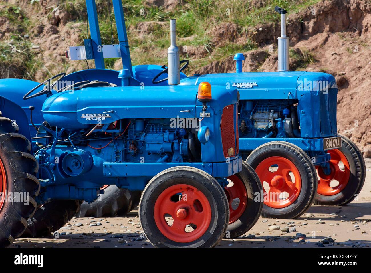 Old tractor used for launching fishing boats Filey Beach, North Yorkshire east coast, busy with holiday makers, Northern England, UK Stock Photo