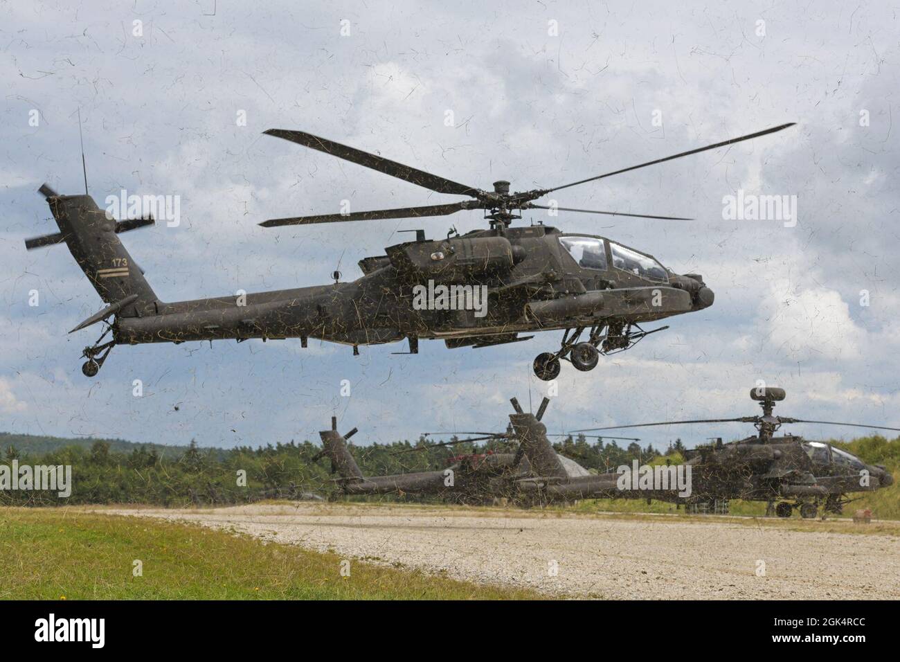 U.S. Soldiers, assigned to 1st Combat Aviation Brigade, 1st Infantry Division, come in for a landing at a forward arming and refueling point in a AH-64D Apache Longbow attack helicopter prior to aerial gunnery training at the 7th Army Training Command's Grafenwoehr Training Area, Germany, Aug. 4, 2021. Stock Photo