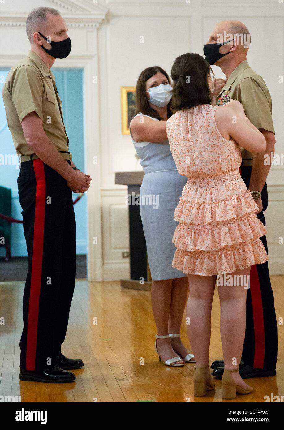 U.S. Marine Corps Lt. Gen. Kevin M. Iiams, Commanding General, Training and Education Command, is pinned by his family during his frocking ceremony at Harry Lee Hall in Quantico, Virginia, August 3, 2021.  Iiams was promoted to Lt. Gen after many years of faithful service. Stock Photo