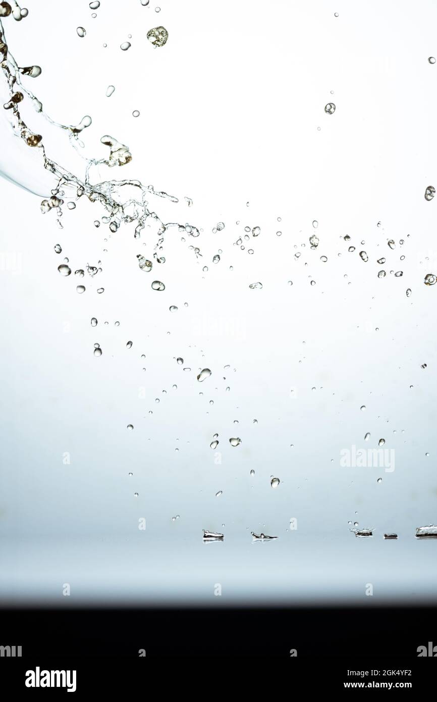 Closeup of water splash and droplets on the glass surface Stock Photo ...