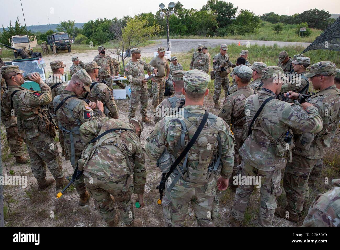 CW1 Miguel Pasana, the officer in charge of the 2021 Forces Command Best Warrior Competition's Day/Night Land Navigation course, gives the competitors instructions and a safety brief, Fort Riley, KS., Aug. 3, 2021. The Army is the best trained, best equipped and most skilled fighting force in the world. Stock Photo