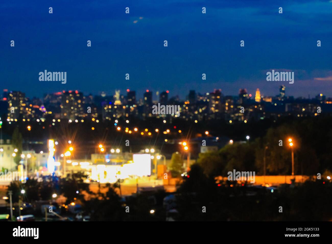 Panorama of a big city at night with a view of high-rise buildings on a ...