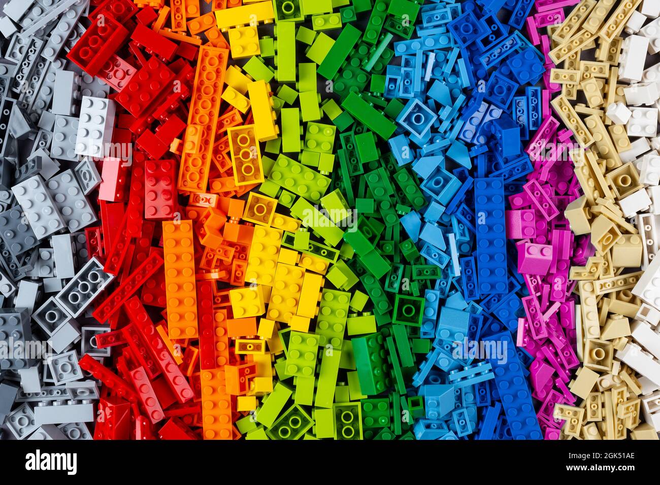 top view of pile of many various colorful rainbow colored stackable plastic toy bricks. childhood education development concept Stock Photo