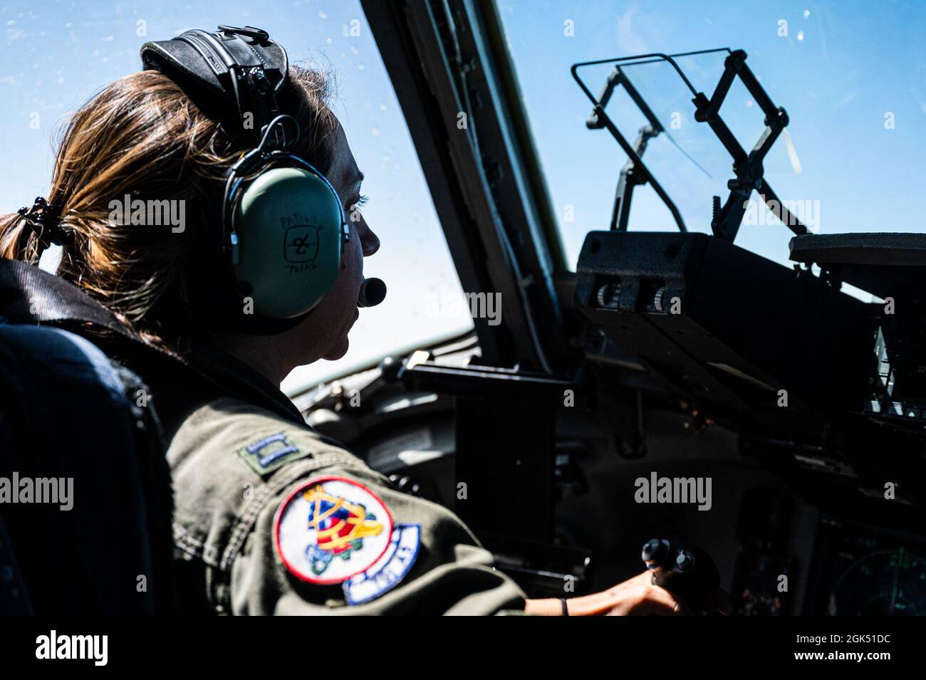 U.S. Air Force Reserve Capt. Chelsea Patino, C-17 pilot, flies a U.S. AFRC C-17 Globemaster III, assigned to the 437th Airlift Wing and 315th Airlift Wing, Joint Base Charleston, South Carolina as it receives fuel from a U.S. Air National Guard KC-135R Stratotanker, assigned to the 121st Air Refueling Wing, Ohio ANG over the southeastern United States Aug. 3, 2021. The C-17 was operated by the U.S. Air Force Reserve's 701st Airlift Squadron. Stock Photo