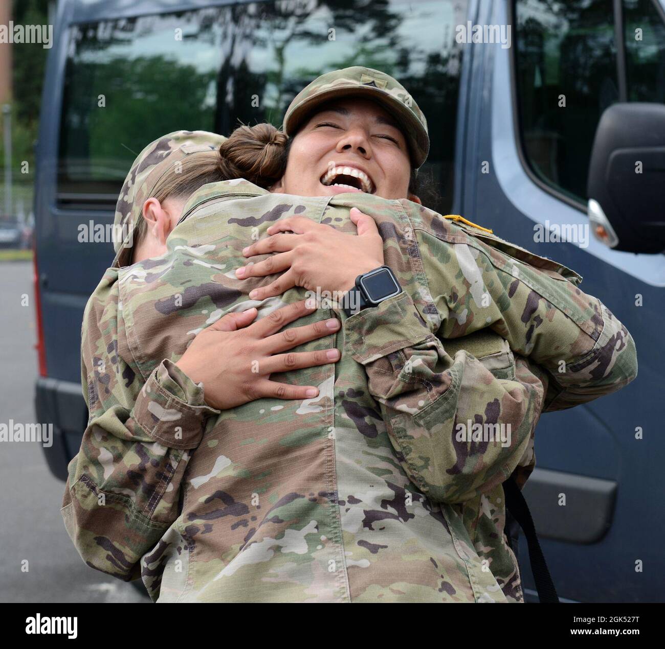 U.S. Army Cpt. Devon Furey with the 67th Forward Resuscitative Surgical  Team welcomes home Sgt. Alex Jimenez with a hug after returning from  Operation Inherent Resolve on August 3, 2021 at Rhine