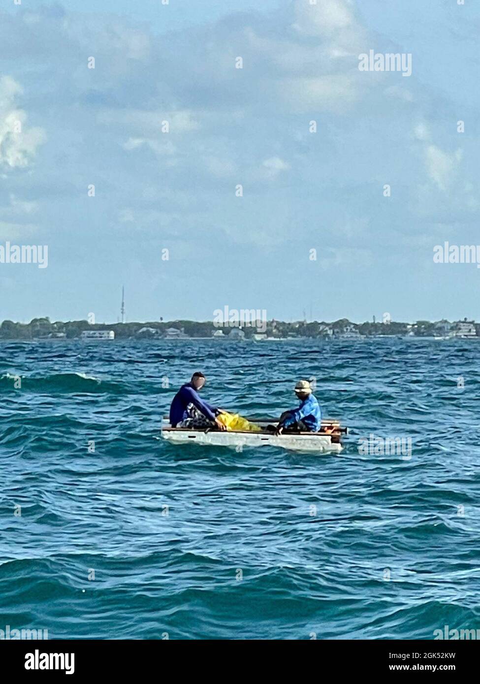 Two Cubans in a 10foot styrofoam hull rustic vessel with off Key West, Aug. 3, 2021. A Station