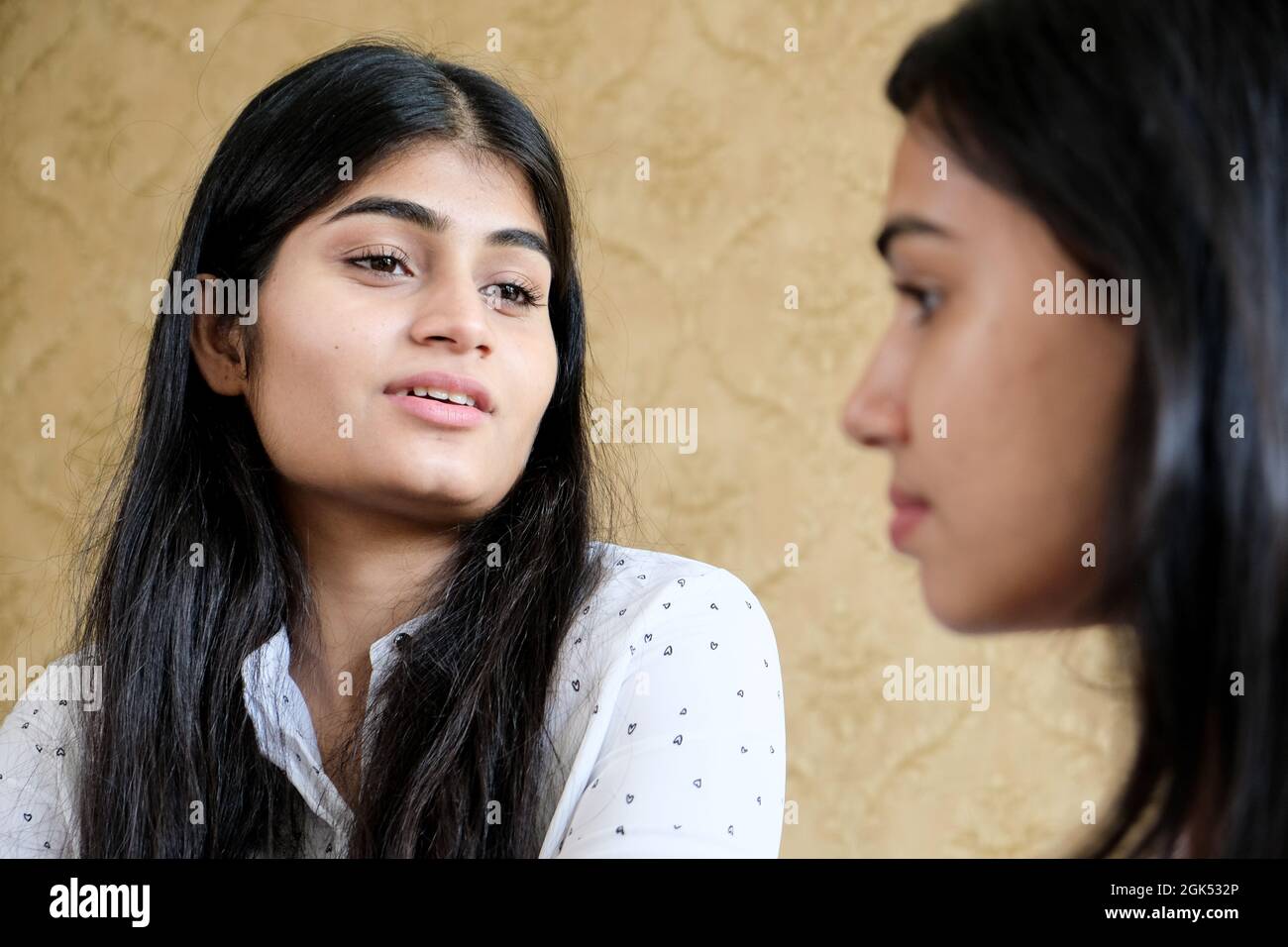 Closeup shot of a young girl talking during the conversation Stock Photo