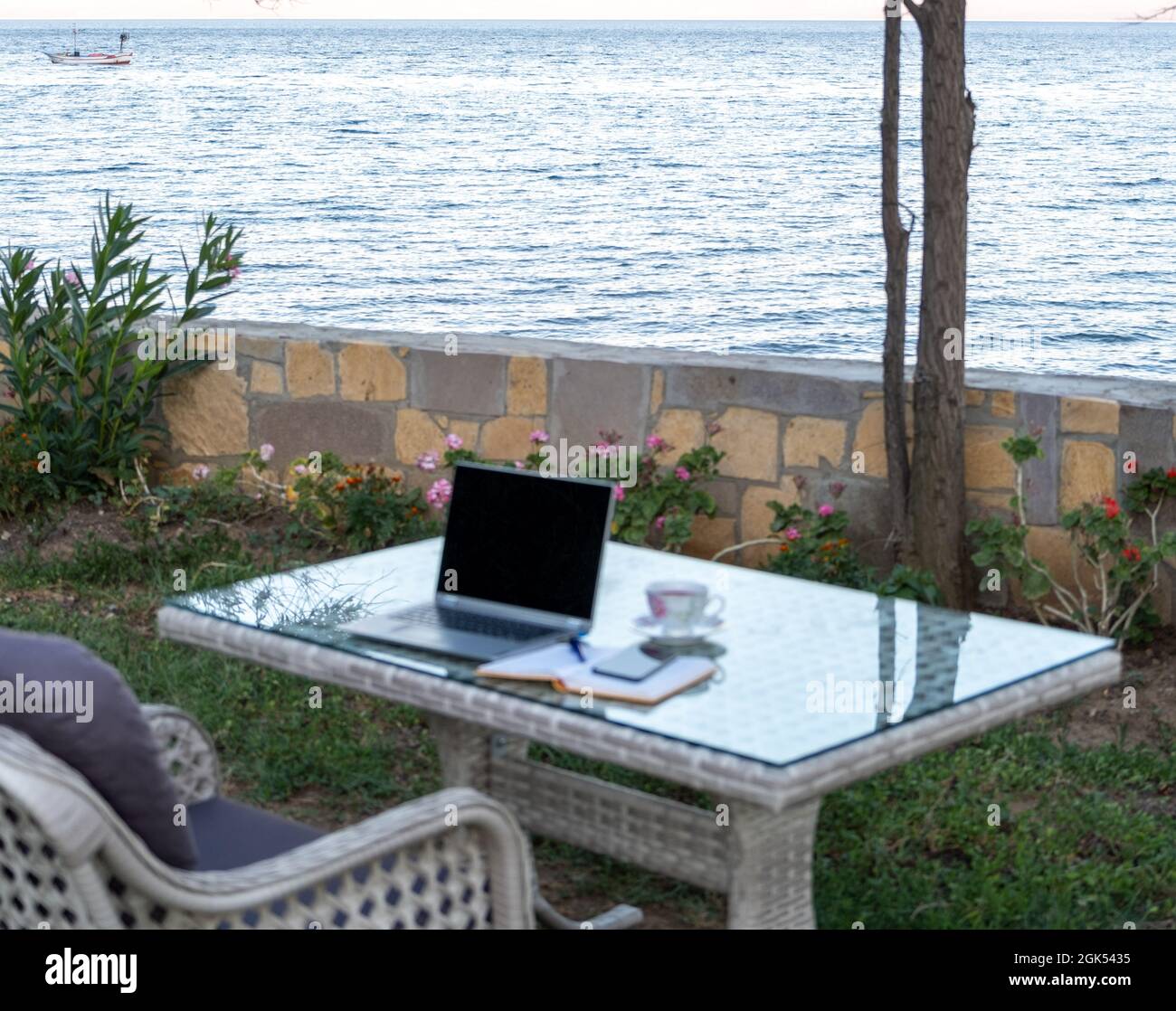 working from summer house remote concept in pandemic, table ready for ...