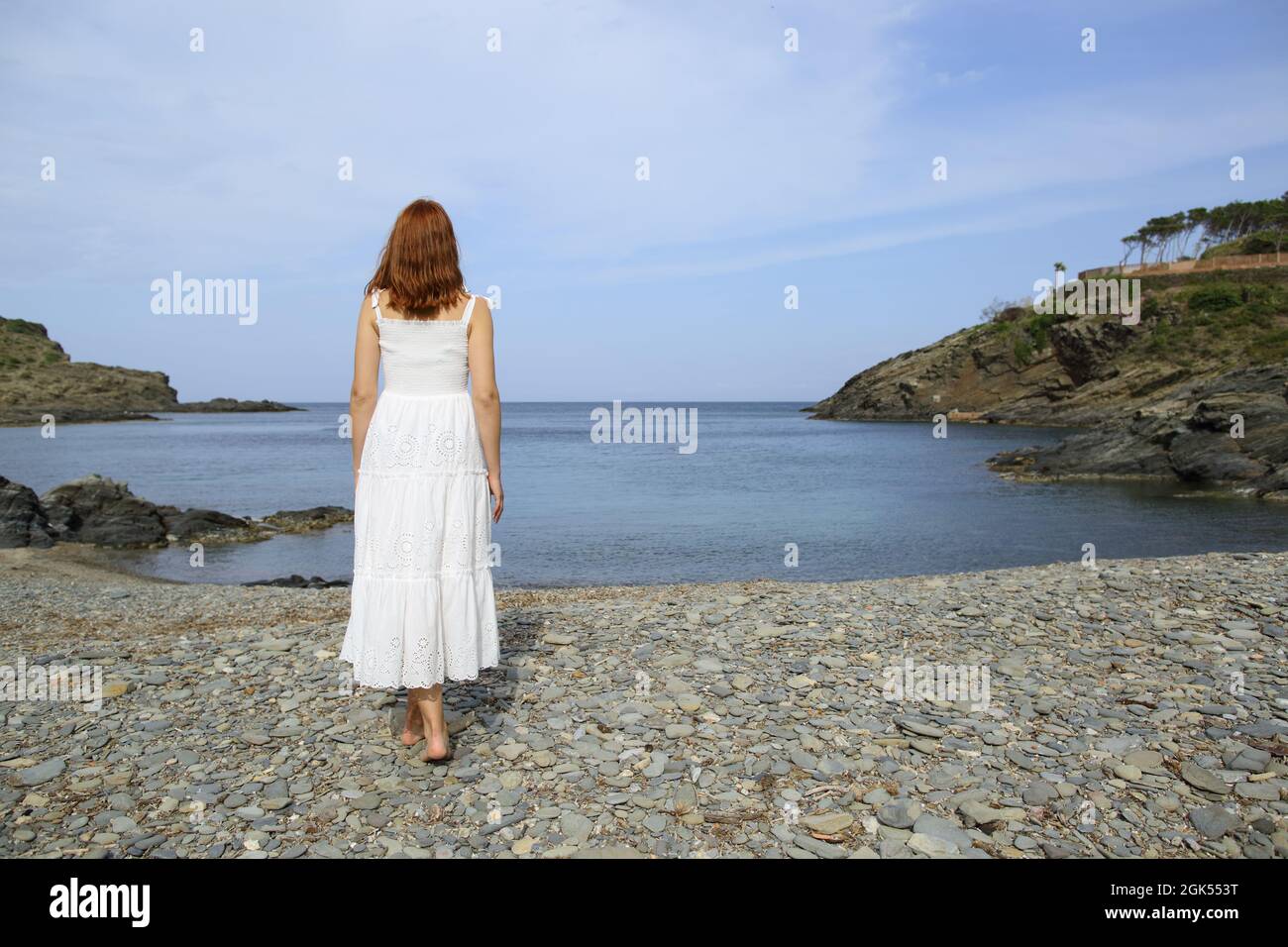 Woman alone walking beach hi-res stock photography and images - Alamy