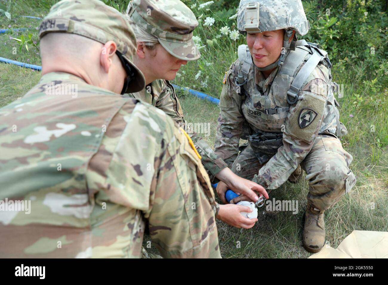 (From left to right) U.S. Army Spc. Garth Heinrich, Sgt. Alicia Plein