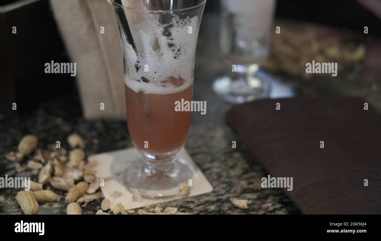 Blurred Photo A Singapore Sling at the Raffles Hotel Long Bar Stock Photo