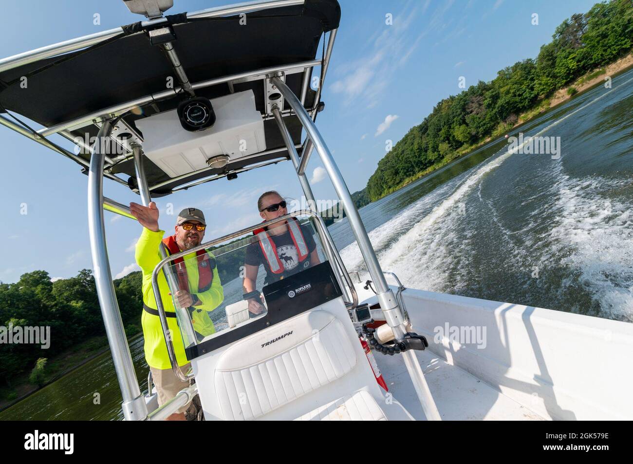 Matt Slezak, a motorboat instructor, guides Silvis, a park