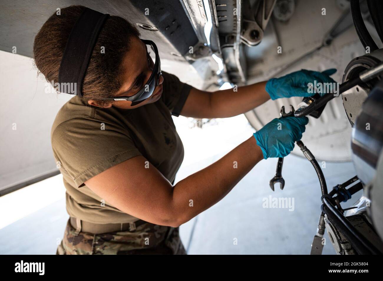 Staff Sgt. Kendra Ancell, 911th Aircraft Maintenance Squadron hydraulics technician, services the nitrogen in a C-17 Globemaster III strut during Operation Steel Moose ’21 at the Pittsburgh International Airport Air Reserve Station, Pennsylvania, Aug. 5, 2021. During the exercise, Operation Steel Moose ’21, Airmen assigned to the 911th Airlift Wing are being tested on their wartime capabilities. Stock Photo