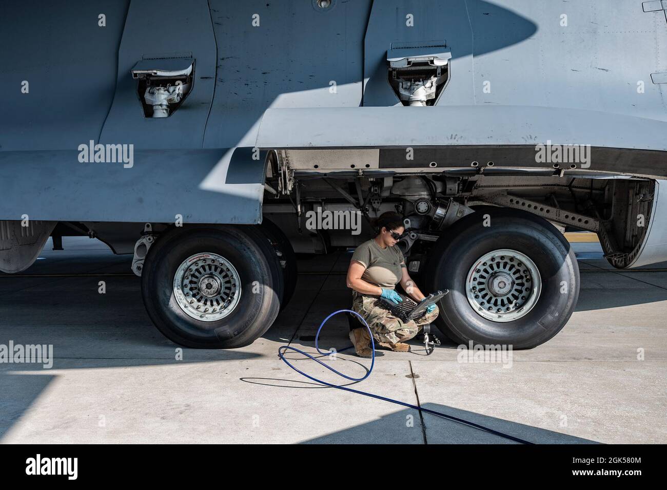 Staff Sgt. Kendra Ancell, 911th Aircraft Maintenance Squadron hydraulics technician, reads a technical order while servicing the nitrogen in a C-17 Globemaster III strut during Operation Steel Moose ’21 at the Pittsburgh International Airport Air Reserve Station, Pennsylvania, Aug. 5, 2021. During the exercise, Operation Steel Moose ’21, Airmen assigned to the 911th Airlift Wing are being tested on their wartime capabilities. Stock Photo