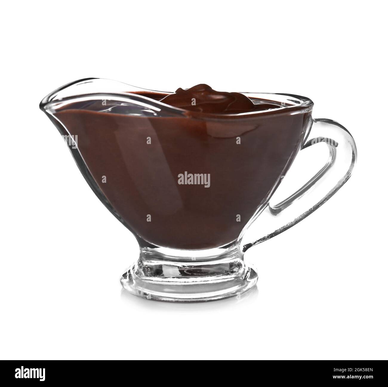 Sauce boat with delicious melted chocolate on white background Stock