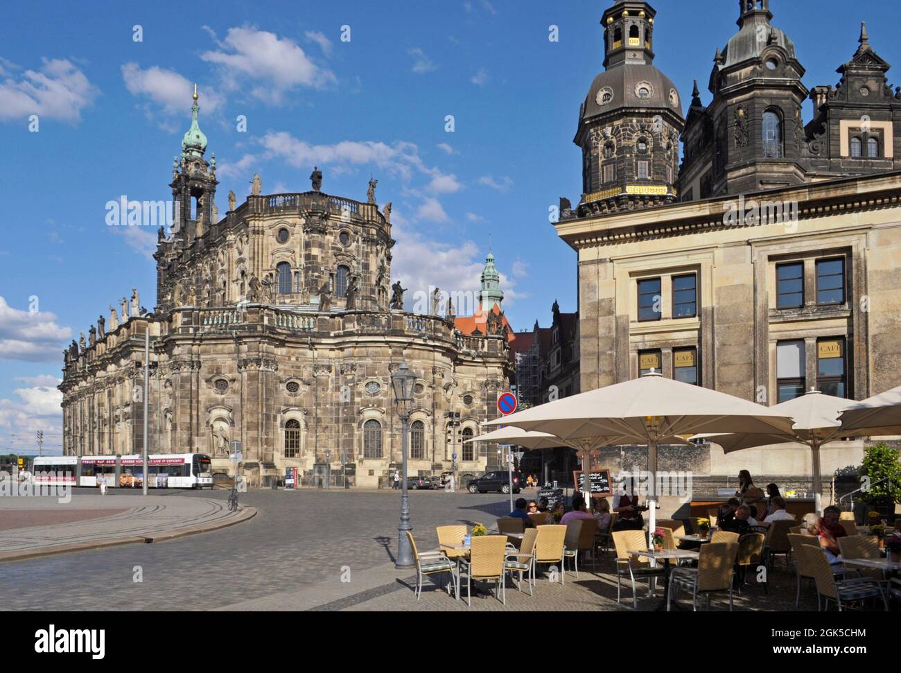 Schinkel cafe in Theaterplatz Square and Hofkirche cathedral or Court Church in the background, Dresden, Germany Stock Photo