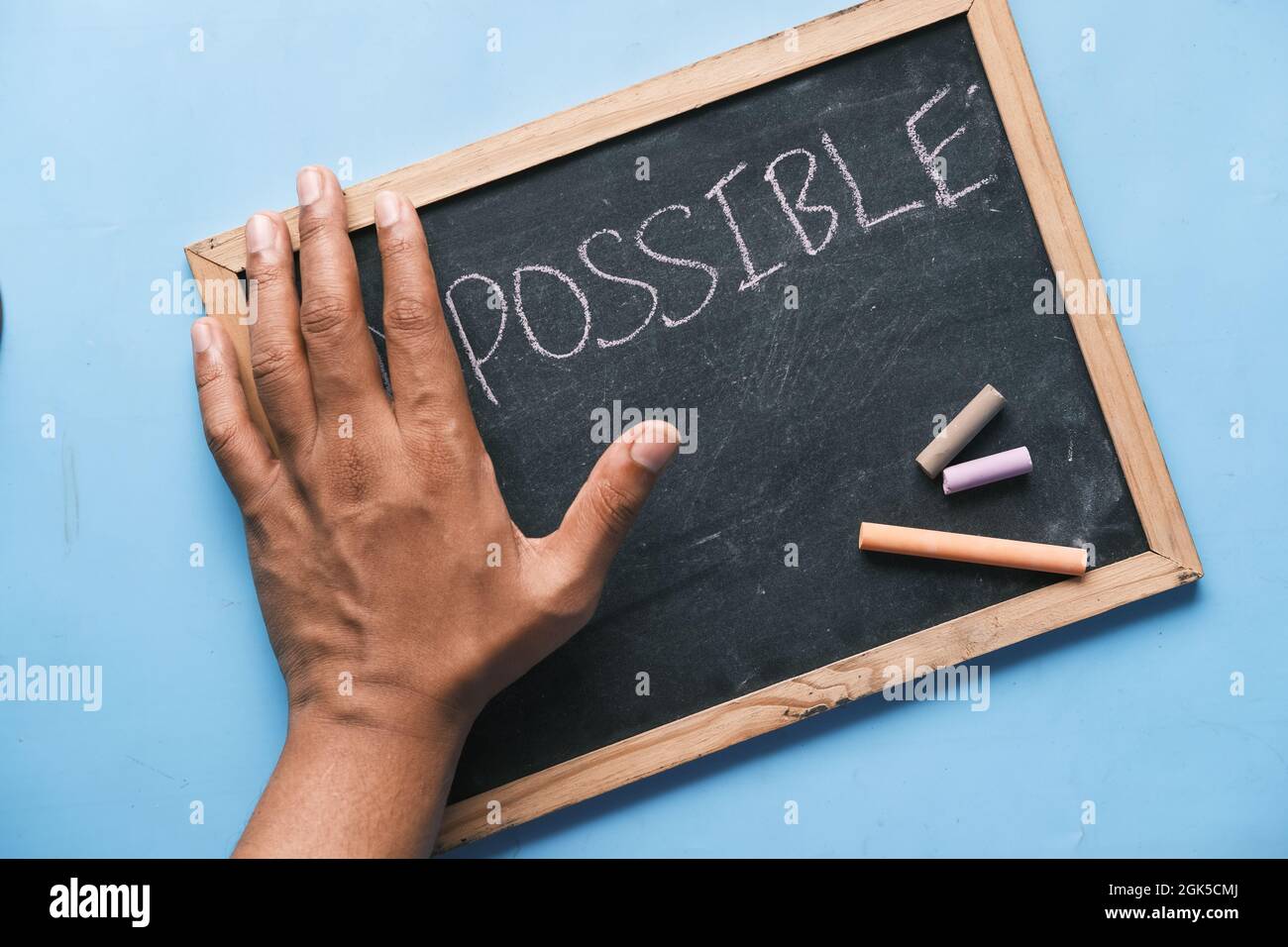young man hand over impossible text . Stock Photo