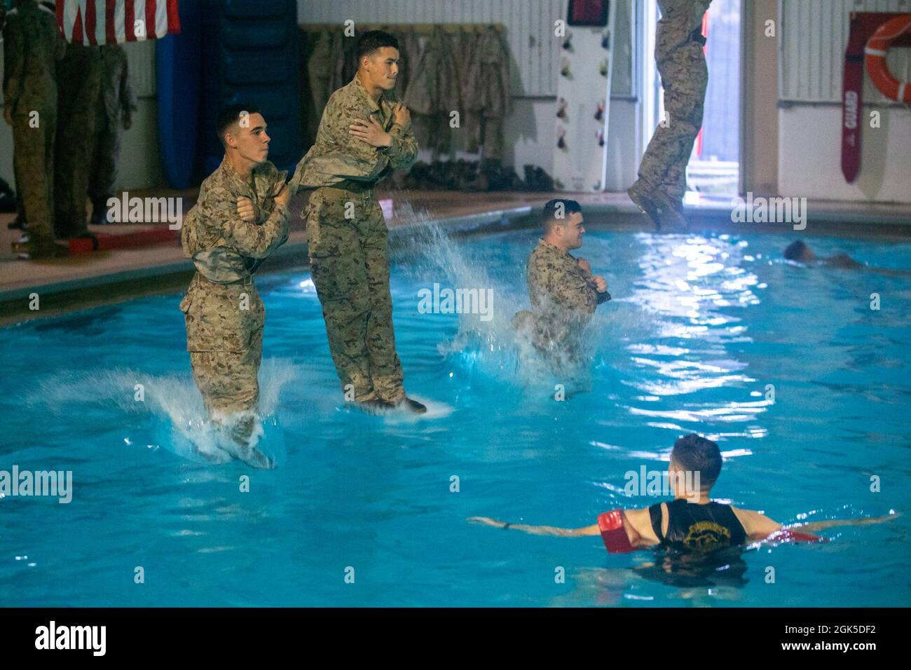 U.S. Marine Corps Officers assigned to The Basic School, conduct Intermediate Swim Qualification on Marine Corps Base Quantico, Virginia, Aug. 6, 2021. Intermediate Swim Qualification is designed to instill the self-confidence needed to overcome mental and physical adversity that could arise during actual combat water survival scenarios. Stock Photo