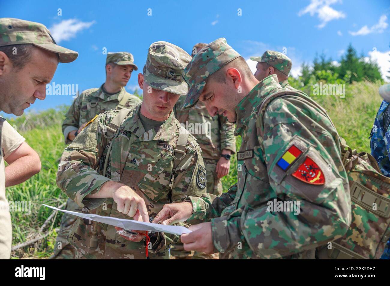 Sgt. Michael Yarrington (center), 108th Training Command, points to a ...