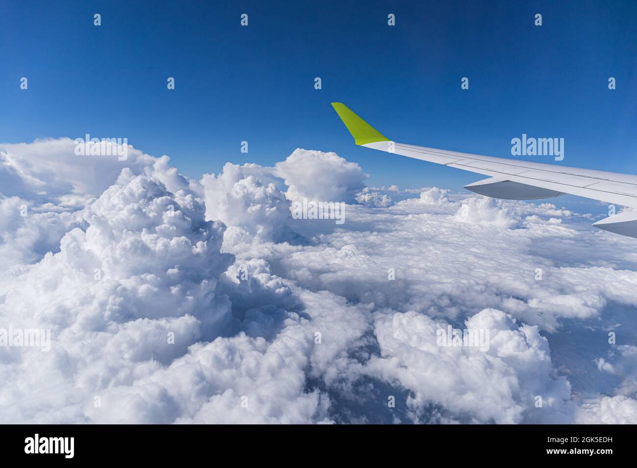Cloud landscape view through plane window Stock Photo - Alamy